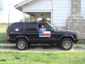 Rural letter carrier Amanda Tucker in her RHD Jeep Cherokee