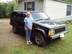 Rural letter carrier Angela Oakley and her RHD Jeep Cherokee