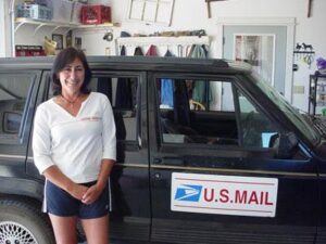Rural letter carrier Anne Greenwood and her RHD Jeep Cherokee