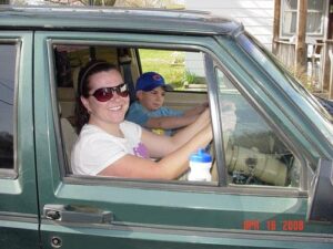 Rural letter carrier Becky Lenartz in the drivers seat of her RHD Jeep Cherokee