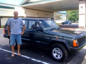 Rural letter carrier Bill Blomme and his right-hand drive Cherokee