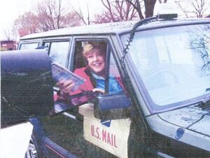 Rural letter carrier Carolyn Elliott delivering mail from her RHD Jeep Cherokee