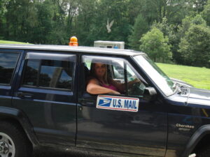 Rural letter carrier Christa Harness and her right-hand drive Cherokee