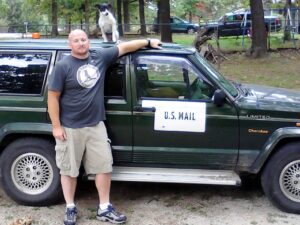 Rural letter carrier Daniel M Smith with his RHD Jeep Cherokee