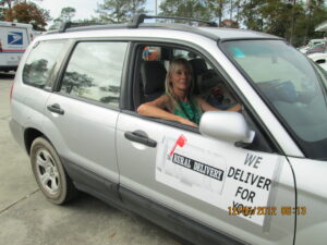 Rural letter carrier Deborah Walker with her RHD Subaru Forester