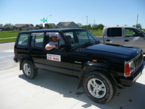 Rural letter carrier Donald Leslie with his RHD Jeep Cherokee