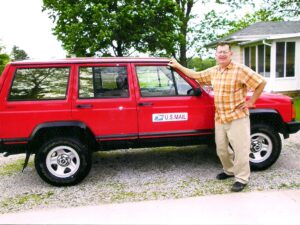 Rural letter carrier Douglas Gerber and his RHD Jeep Cherokee