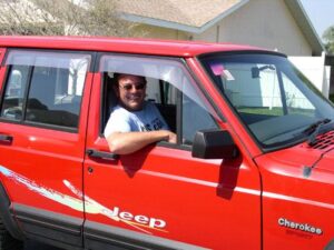 Rural letter carrier Herb Keifel with his RHD Jeep Cherokee