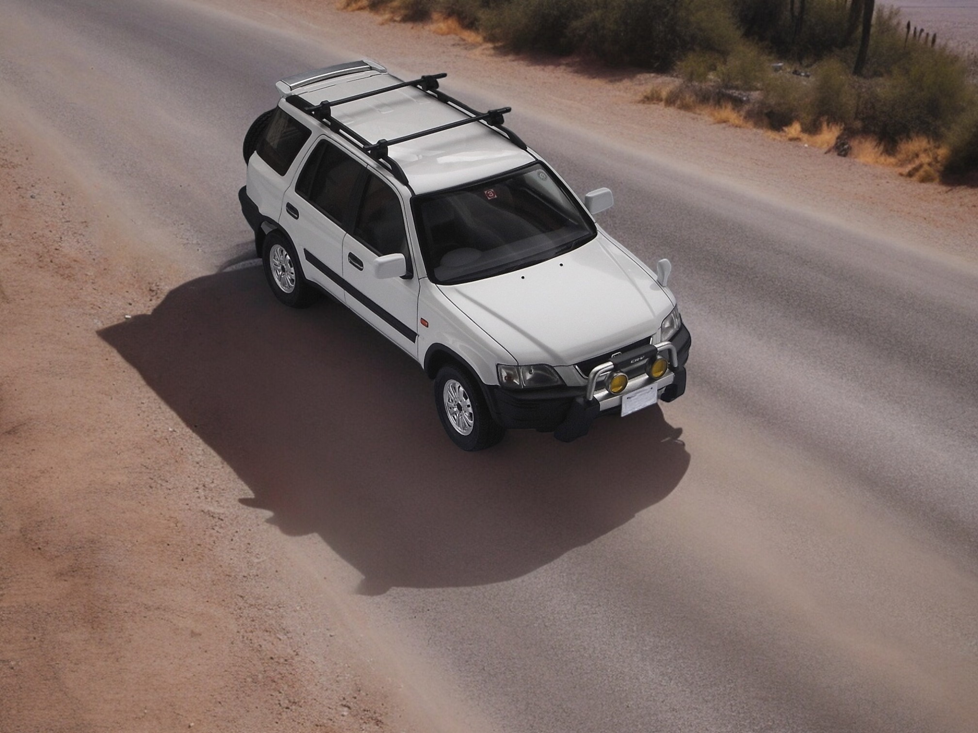 RHD Honda CR-V right front drone view on desert road
