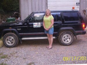 Rural letter carrier Jenny Rich with her RHD Jeep