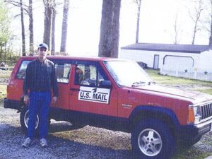 Rural letter carrier Jim Green with his RHD Jeep Cherokee