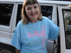 Rural letter carrier Karen Rice with her RHD Jeep Cherokee postal delivery vehicle