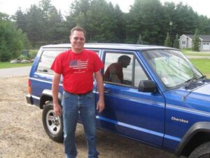 Rural letter carrier Kent Wilson with his RHD Jeep