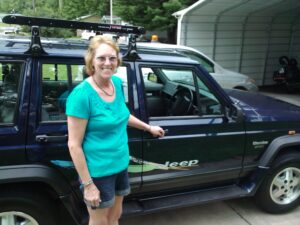 Rural letter carrier Kimberly Cunningham and her RHD Jeep Cherokee
