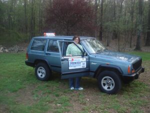 Rural letter carrier Laura Gargis with her RHD Jeep