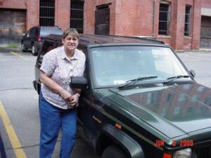 Rural letter carrier Laureen Wilson and her RHD Jeep Cherokee