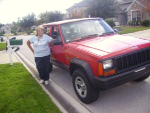 Rural postal worker Malina Green with her RHD Jeep Cherokee