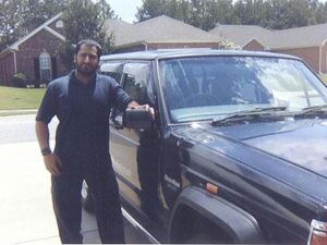 Rural letter carrier Ishteaq Shad with his RHD Jeep