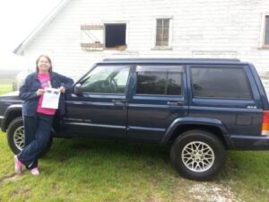 Rural letter carrier Mary Behrends and her RHD Cherokee
