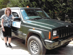Rural letter carrier Mary Skaar and her RHD Jeep Cherokee delivery vehicle