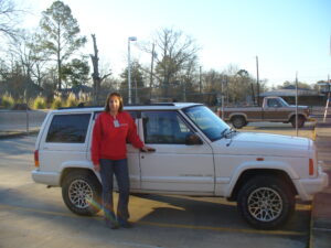 Rural letter carrier Pam Forrest with her RHD Jeep Cherokee