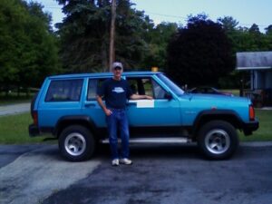 Rural letter carrier Randy St Clair and his RHD Jeep Cherokee