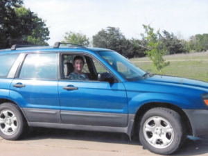 Rural letter carrier Coleen Kelly in her RHD Subaru Forester