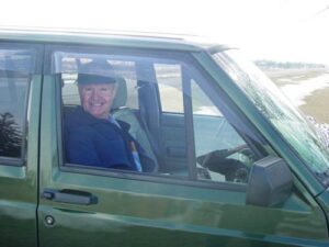 Rural letter carrier Ron Smith driving his RHD Jeep Cherokee mail delivery vehicle