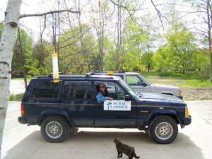 Rural letter carrier Sheree Stein and her RHD Cherokee delivery vehicle