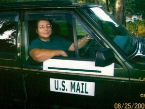 Rural letter carrier Stefania Fratini-Garrant with her RHD Jeep Cherokee