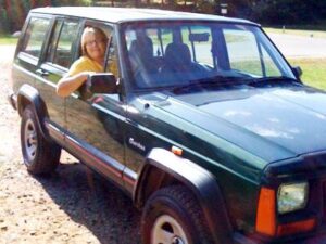 Rural letter carrier Suzanne Blank and her right-hand drive Jeep Cherokee