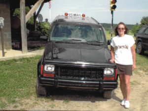 Rural letter carrier Timmi Rightmire with her RHD Jeep Cherokee