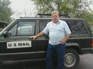 Rural letter carrier Tom Simpson and his RHD Jeep Cherokee