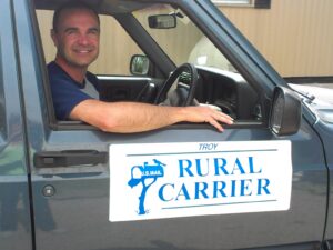 Rural letter carrier Troy Frazee driving his RHD Cherokee