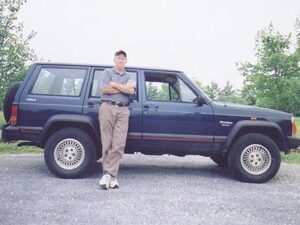Rural letter carrier William Stedebaker with his factory RHD Jeep Cherokee
