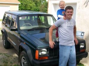 Rural letter carrier Zachary Ross with his RHD Jeep Cherokee