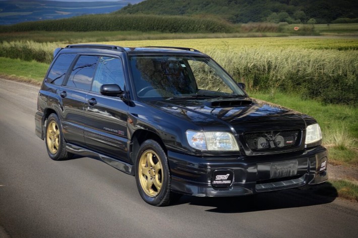 RHD Subaru Forester in black from right front
