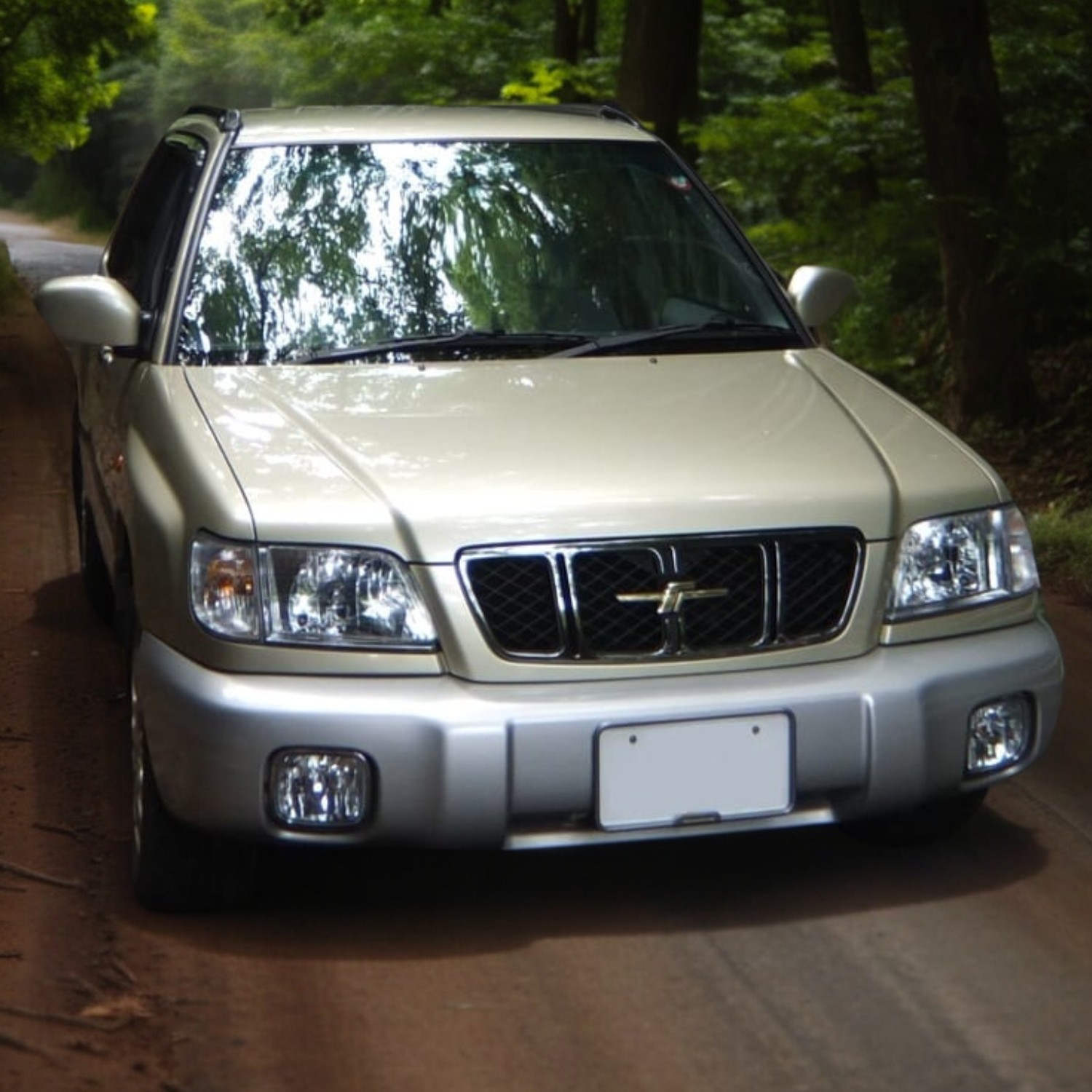 RHD Subaru Forester in champagne from right front