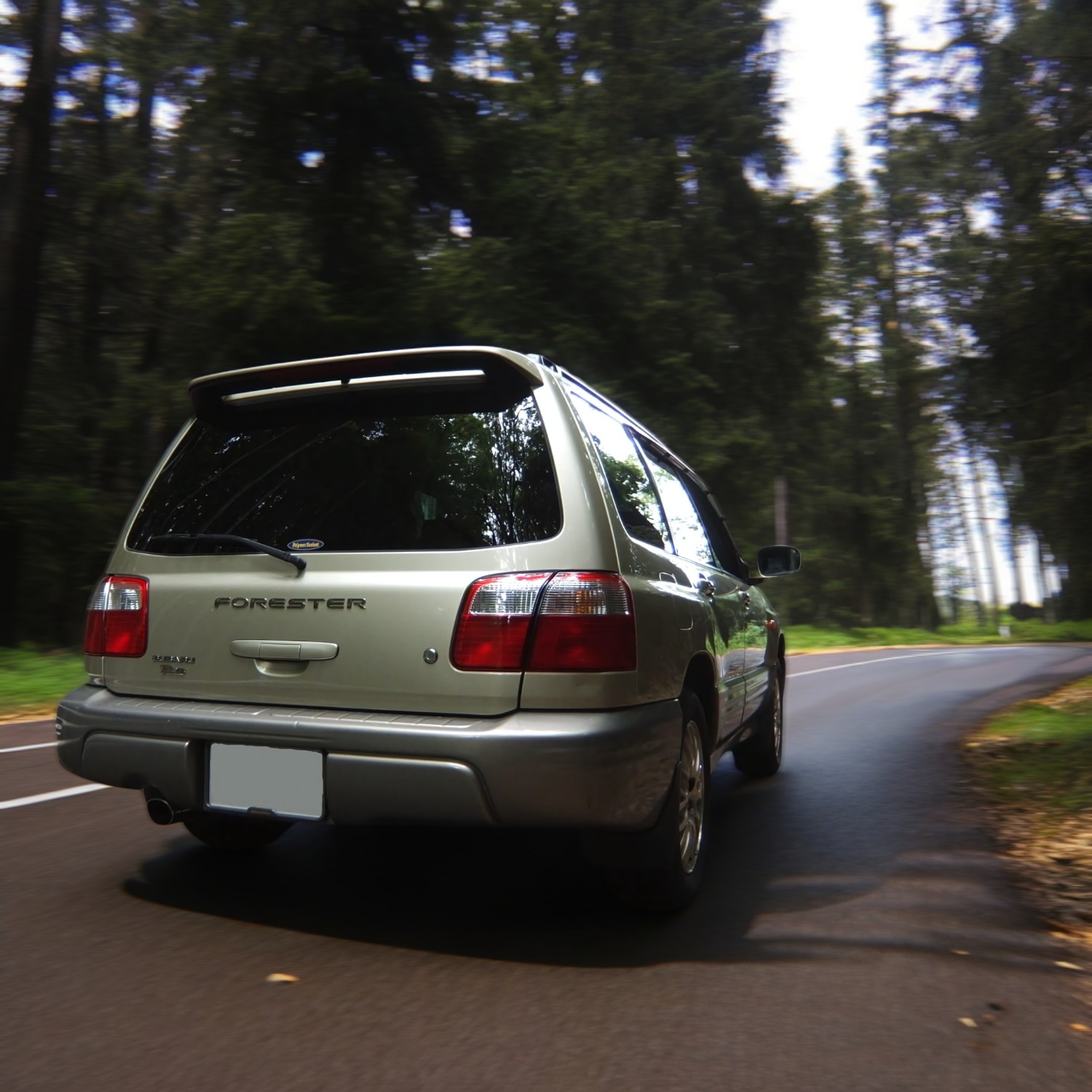 RHD Subaru Forester in champagne from right rear