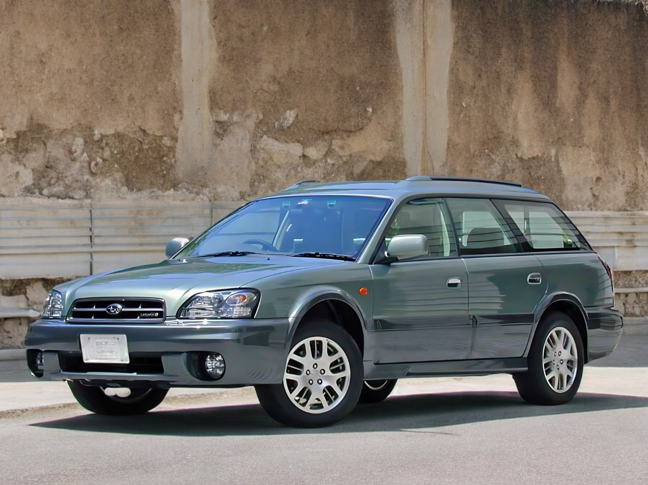 Third generation RHD Subaru Legacy Wagon in metallic pale green from left front