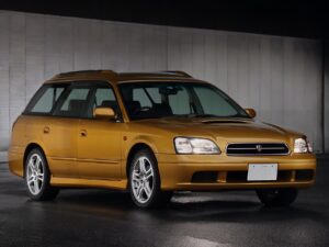 Third generation RHD Subaru Legacy Wagon in metallic orange from right front