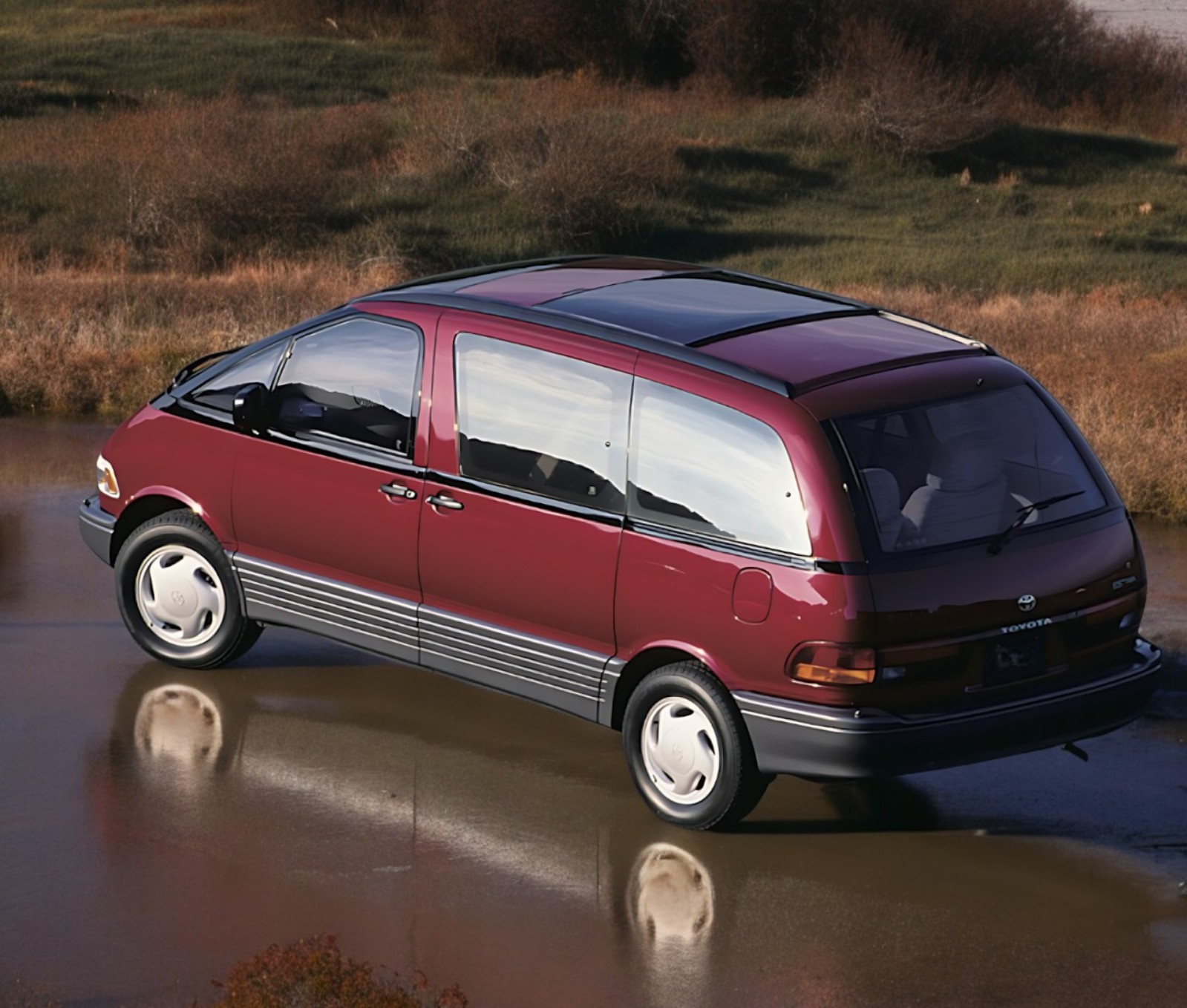 RHD Toyota Estima (Previa) in red from left rear side drone shot